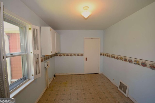 tiled empty room with plenty of natural light