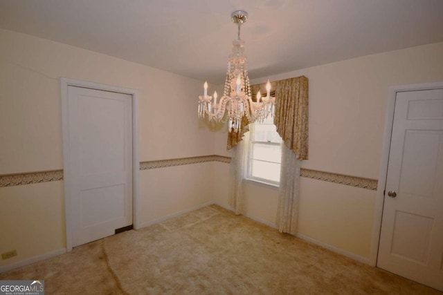 unfurnished dining area featuring light carpet and an inviting chandelier