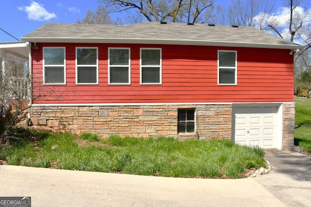 view of side of home with a garage