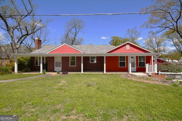 ranch-style home with a porch and a front yard