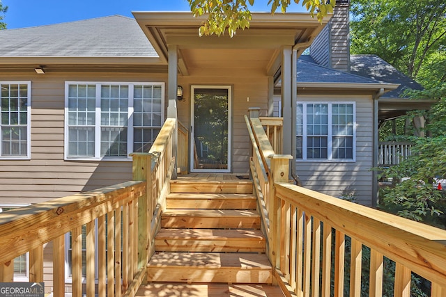 entrance to property featuring a deck