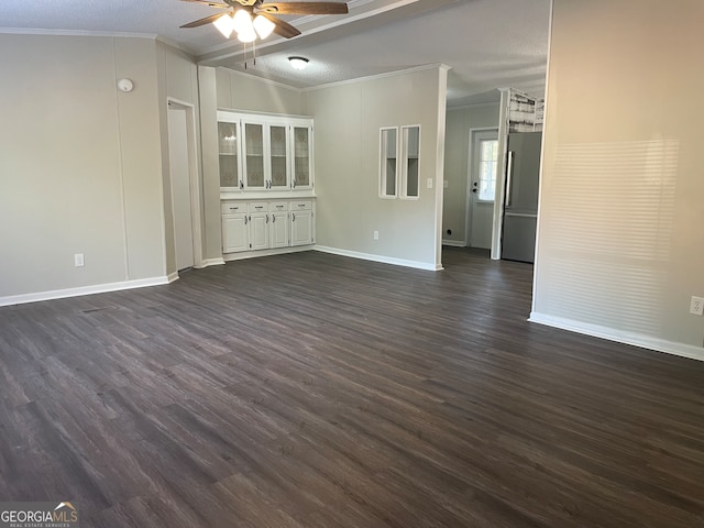 unfurnished living room with ceiling fan, a textured ceiling, crown molding, and dark wood-type flooring