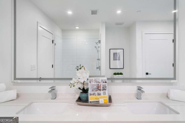 bathroom featuring vanity and walk in shower