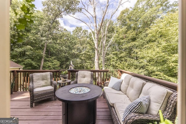 133 Oak Dr, Gray, GA 31032 - wooden terrace featuring an outdoor living space with a fire pit