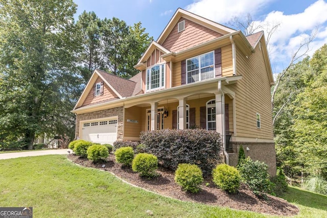 craftsman inspired home with covered porch and a front lawn