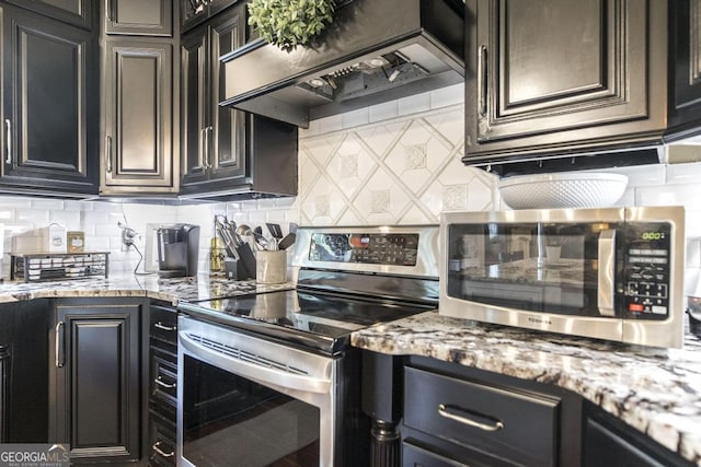 133 Oak Dr, Gray, GA 31032 - kitchen with appliances with stainless steel finishes, custom exhaust hood, backsplash, and light stone countertops