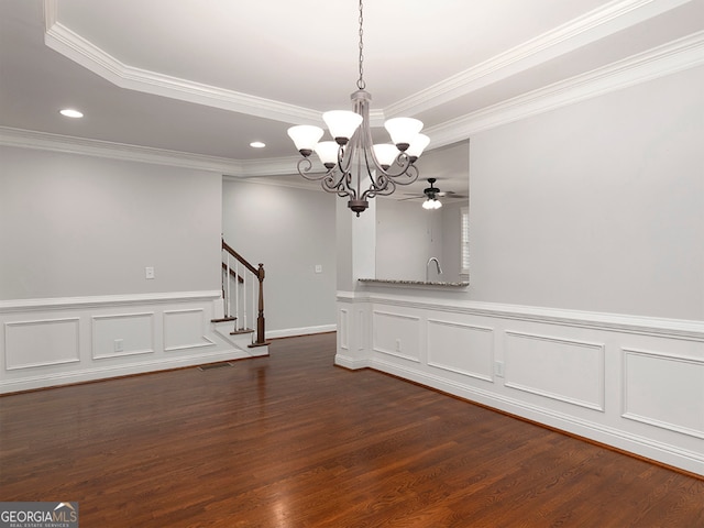 empty room with ceiling fan with notable chandelier, sink, dark hardwood / wood-style floors, and crown molding