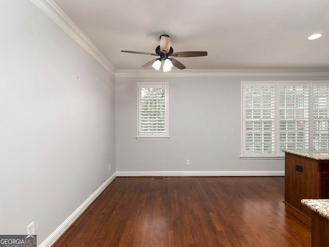 spare room with ornamental molding, ceiling fan, dark hardwood / wood-style floors, and a healthy amount of sunlight