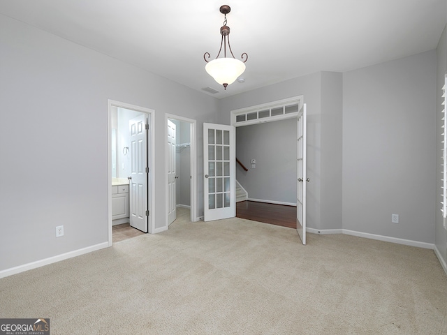 interior space featuring light carpet