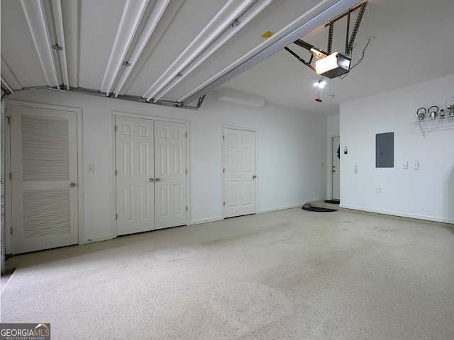 garage featuring a garage door opener and electric panel