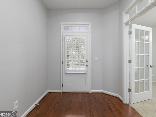 entryway with dark wood-type flooring