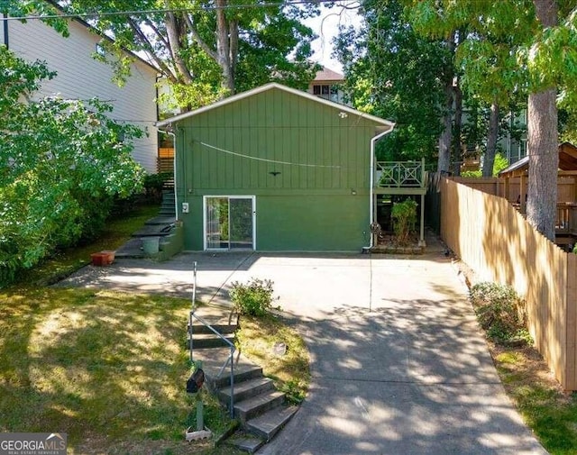 view of outbuilding with fence