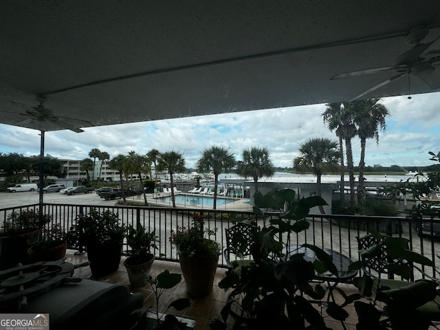 balcony featuring a ceiling fan