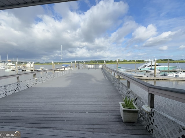 wooden deck featuring a water view