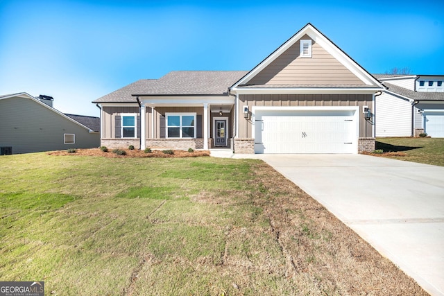 craftsman inspired home with a front yard and a garage