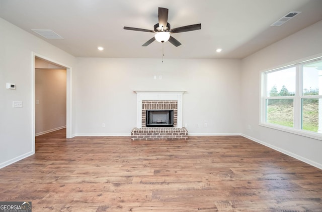 kitchen featuring light stone counters, dark hardwood / wood-style floors, backsplash, white cabinets, and appliances with stainless steel finishes