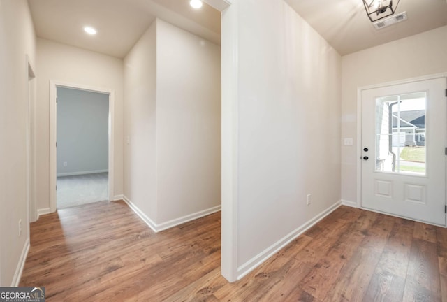 unfurnished living room featuring ceiling fan, hardwood / wood-style floors, and a brick fireplace