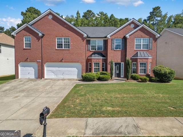 view of front of property featuring a garage and a front lawn