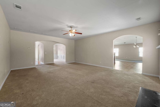 carpeted empty room with ceiling fan