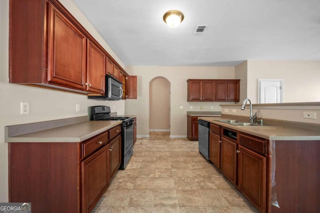 kitchen featuring light tile patterned floors, sink, and stainless steel appliances