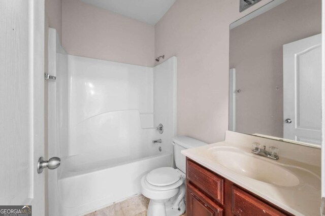 full bathroom with tile patterned flooring, toilet, vanity, and shower / bath combination