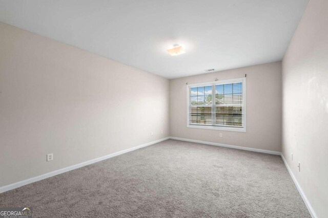 spare room with carpet floors