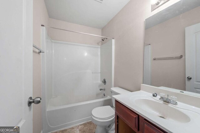 full bathroom featuring tile patterned floors, vanity, tub / shower combination, and toilet