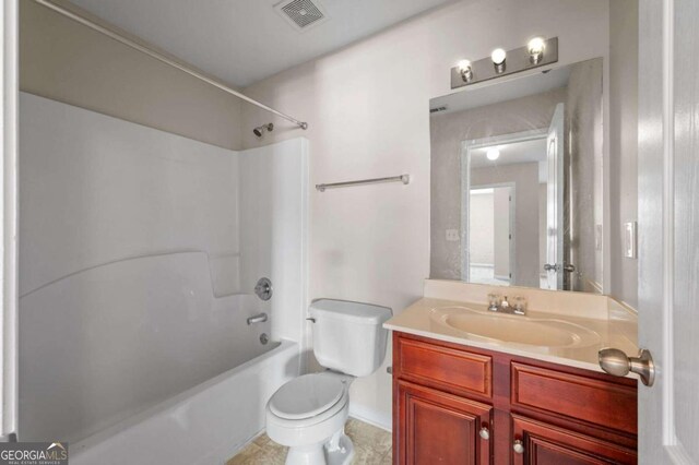 full bathroom featuring tile patterned floors, vanity, shower / tub combination, and toilet