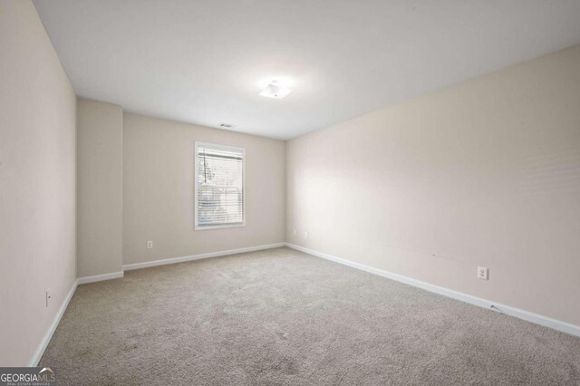 unfurnished room featuring carpet floors