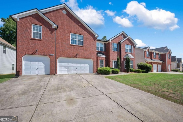 view of front facade featuring a garage and a front lawn