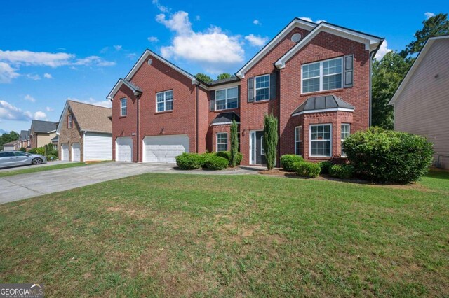 view of front property with a garage and a front yard