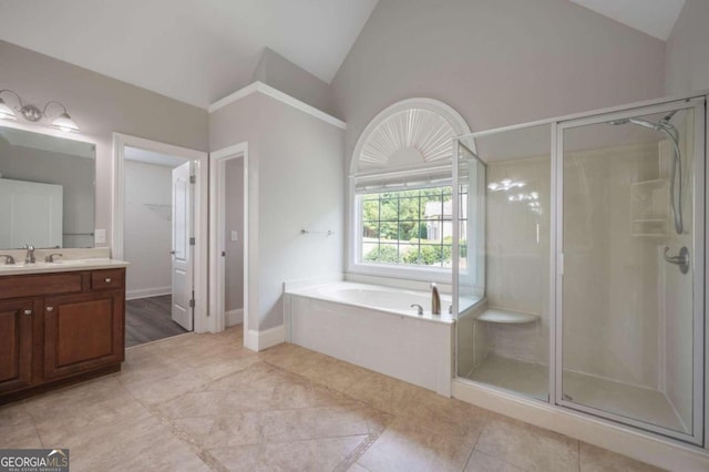 bathroom with tile patterned flooring, high vaulted ceiling, vanity, and shower with separate bathtub