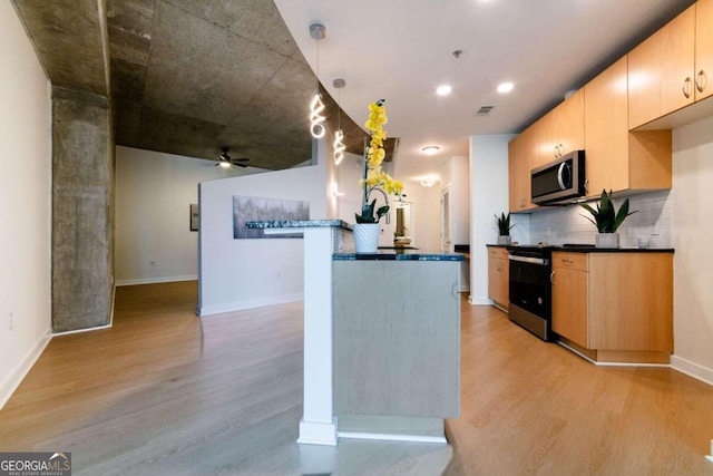 kitchen with ceiling fan, decorative backsplash, range with electric cooktop, light brown cabinetry, and light hardwood / wood-style floors