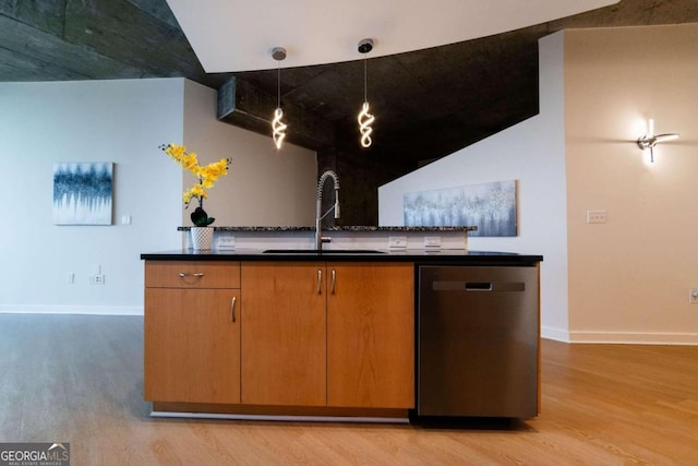 kitchen with sink, dishwasher, pendant lighting, and light hardwood / wood-style flooring