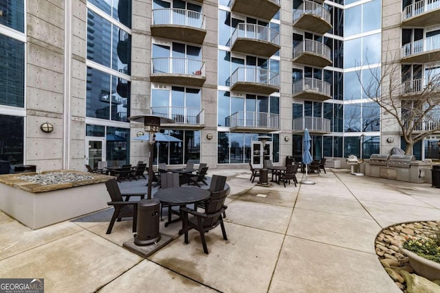 view of patio featuring a balcony