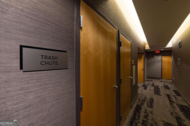 hallway featuring carpet flooring