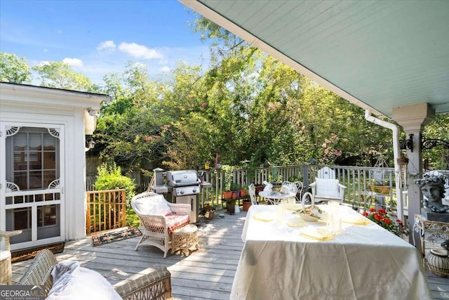 wooden deck featuring grilling area