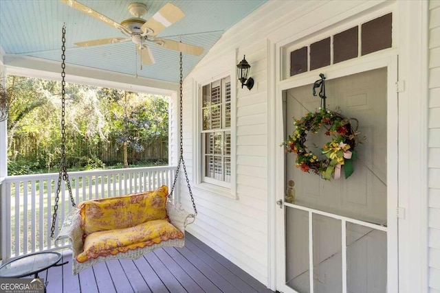 wooden deck with ceiling fan