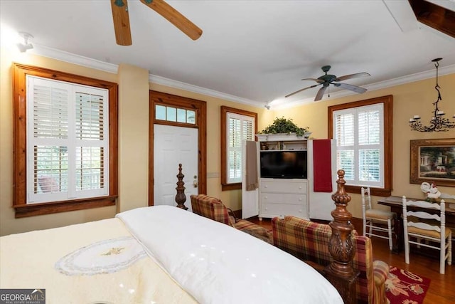 bedroom featuring ceiling fan, crown molding, and dark hardwood / wood-style flooring