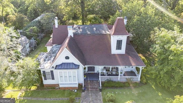 exterior space featuring a porch and a front yard