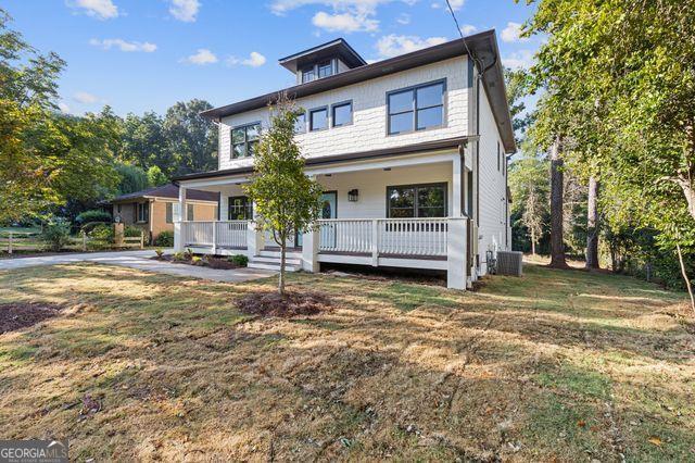 view of front of house with a front yard, covered porch, and central air condition unit