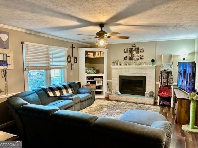 living room with ceiling fan, hardwood / wood-style flooring, crown molding, and a textured ceiling