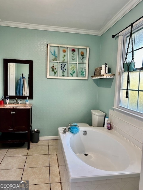 bathroom with toilet, ornamental molding, tiled bath, and vanity