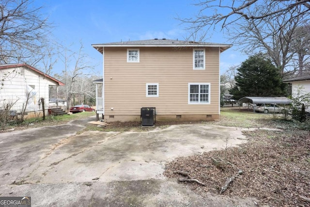 rear view of property with crawl space