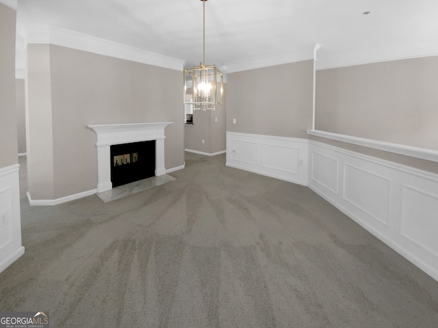 unfurnished living room featuring a chandelier, carpet, and ornamental molding