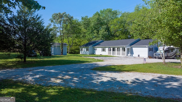 ranch-style home with a front yard