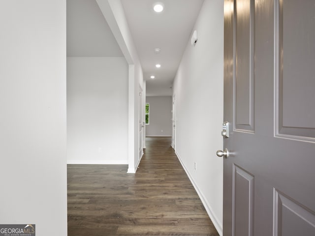 hallway featuring dark wood-type flooring