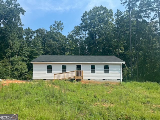 back of property featuring a deck