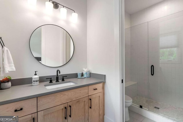 full bathroom with tile patterned flooring, a stall shower, toilet, and vanity