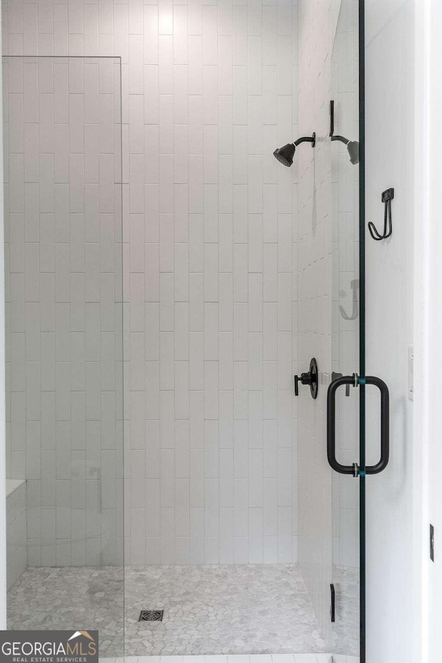 bathroom with a stall shower